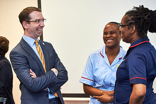 Peter meeting with two nurses