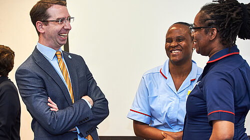 Peter meeting with two nurses