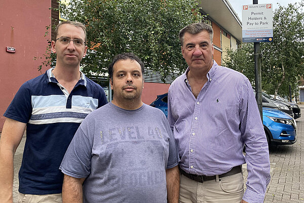 Mayor Peter Taylor, Holywell campaigner Emil Rowe, and Park ward councillor Peter Kloss at the car park
